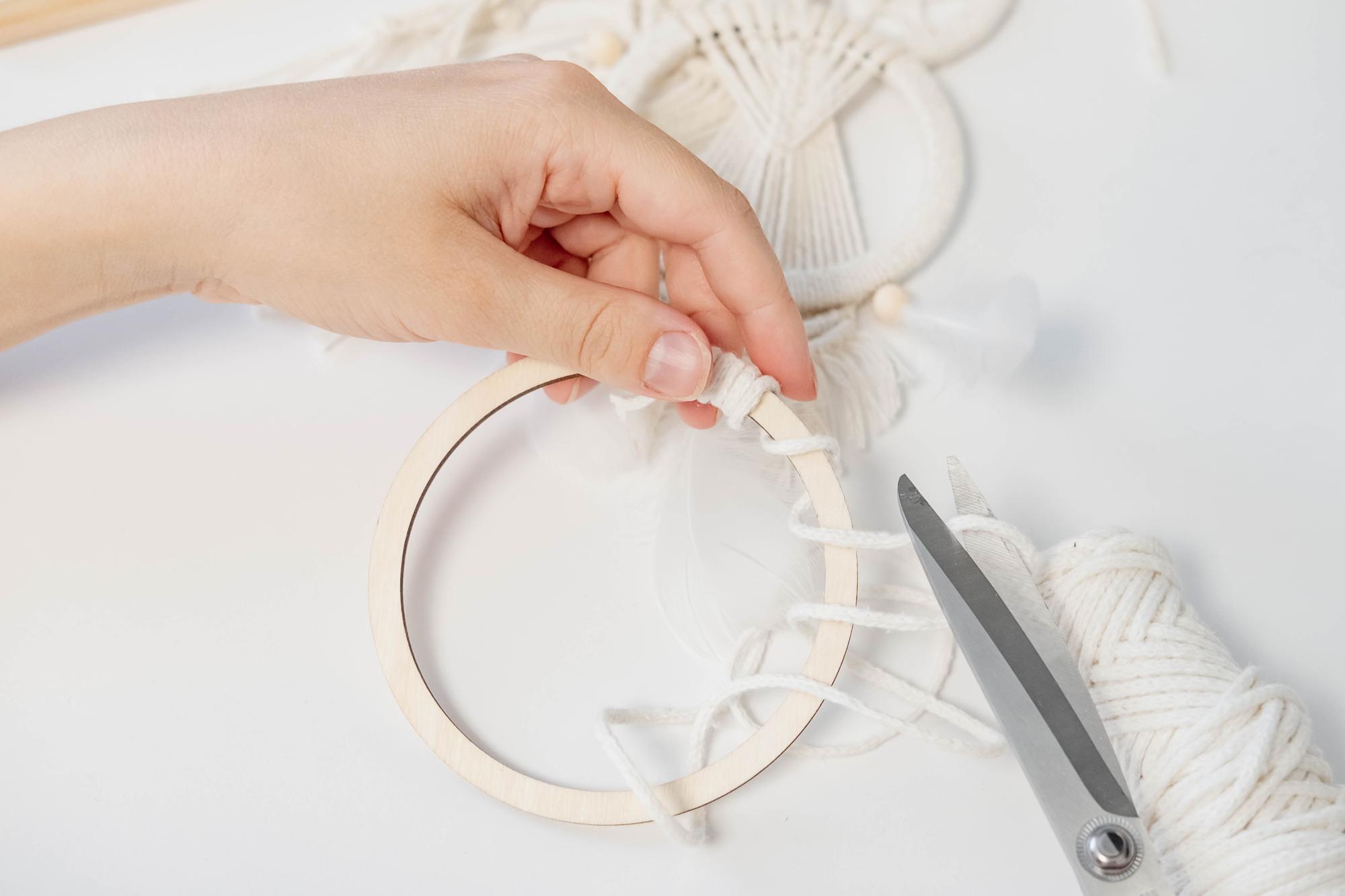 Artisan at an embroidery hoop in natural light