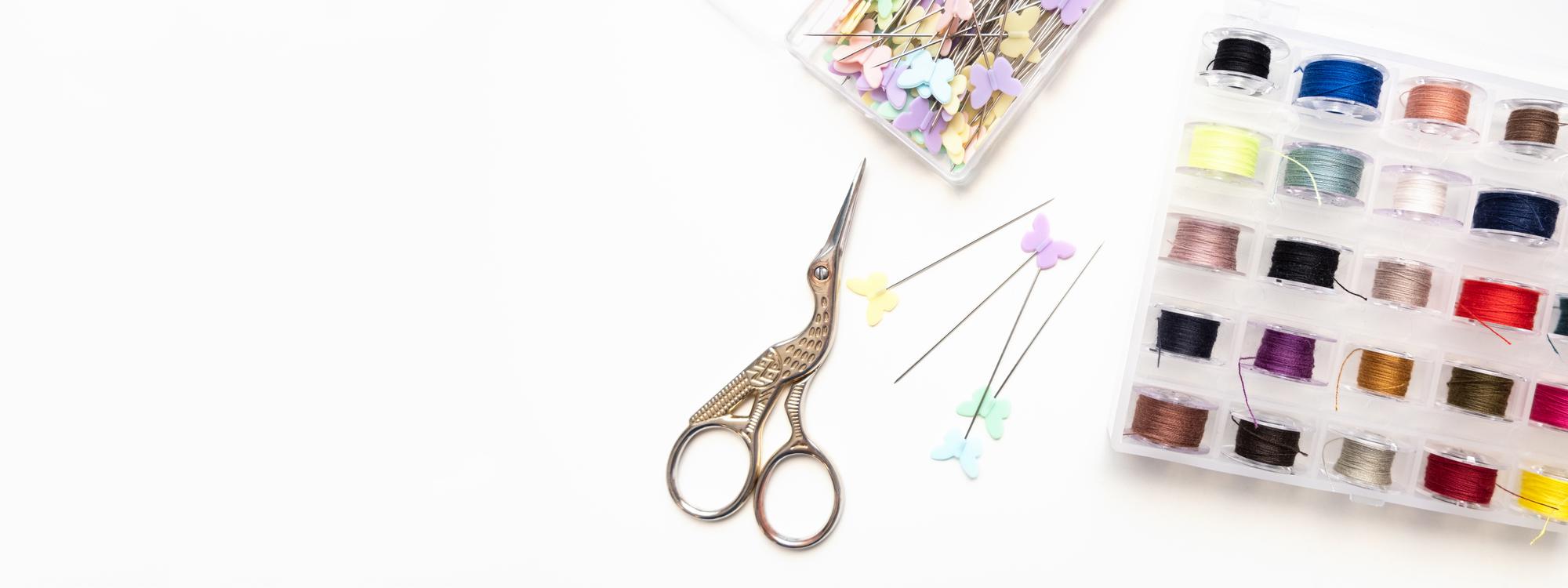 Workspace with embroidered samples and tools